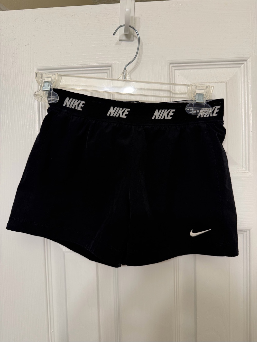 Nike Women’s Black Athletic Shorts with White Swoosh and Branded Waistband
